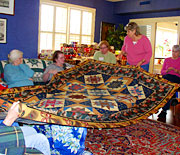 Admiring a quilt
