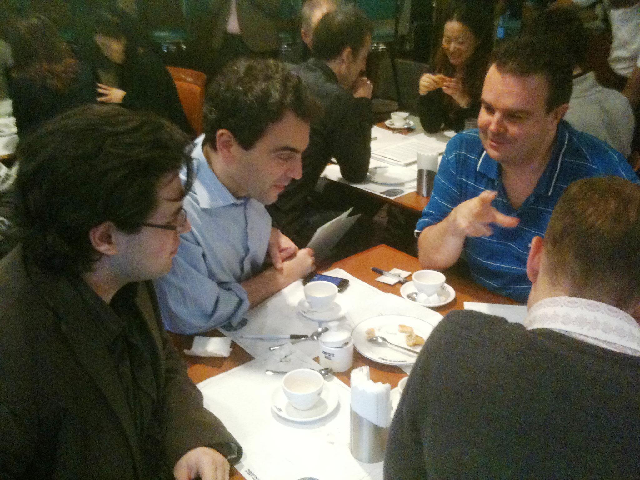 JMEC 16 participants reviewing past business plans