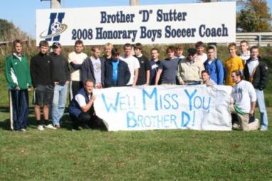 bro d and alumni with sign.JPG