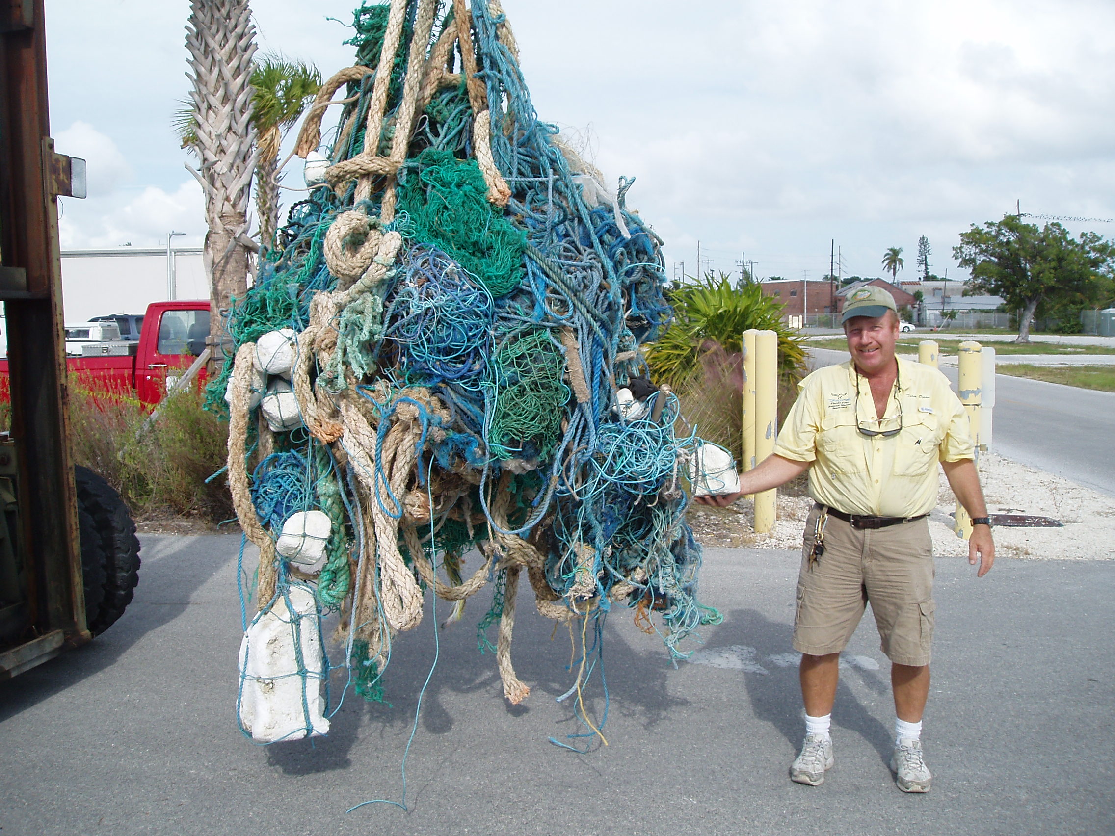 Robert Keeley poses with 450 pounds of marine debris