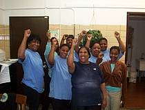 hosptial workers with fists raised.jpg